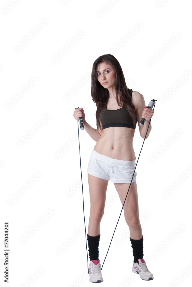 Young athletic woman keeping a string with elastic bandage Young athletic woman keeping a string with elastic bandage