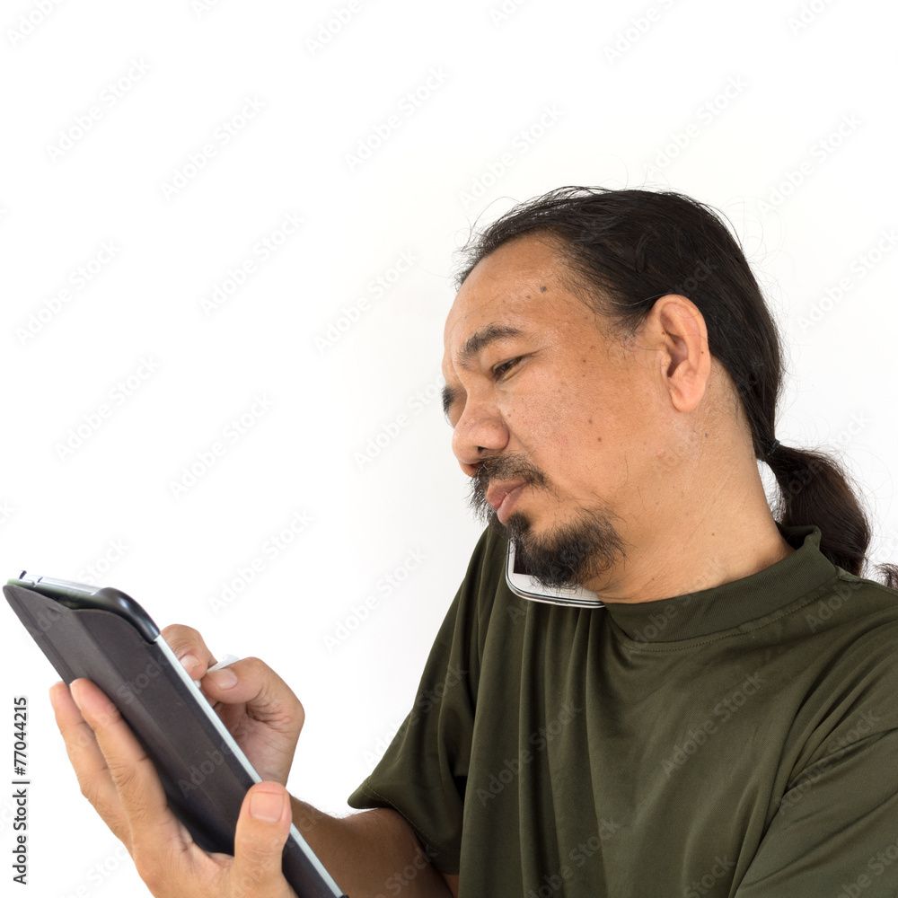 Old asian man using tablet-pc on white background. Old asian man using tablet-pc on white background.