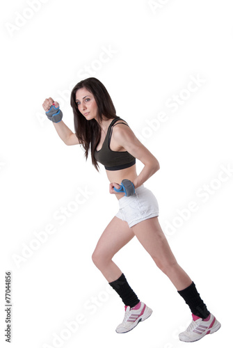 Young athletic woman with wrist weights