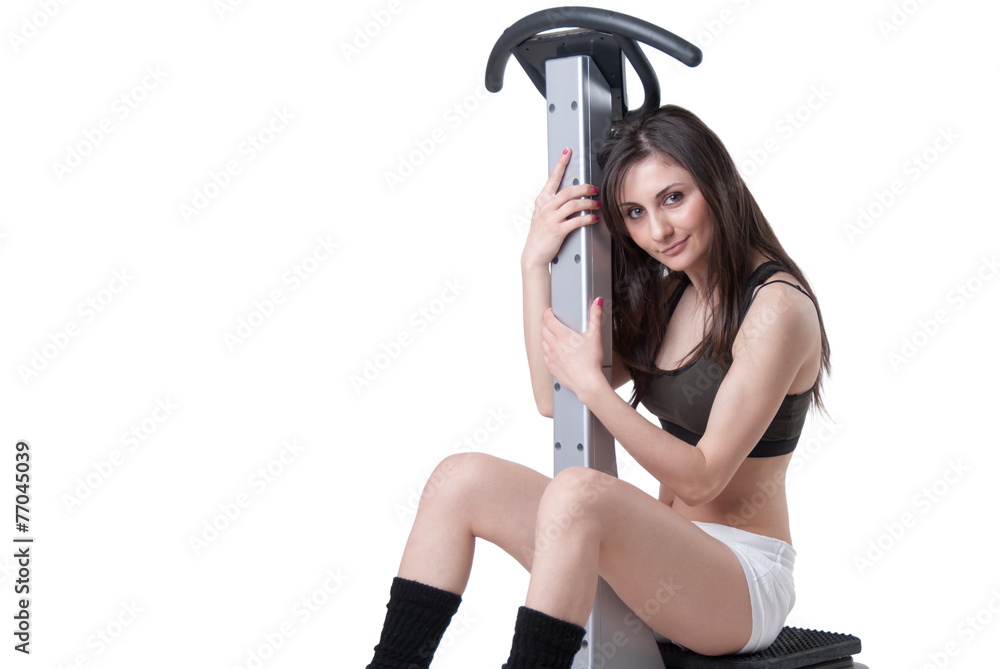 Young athletic woman with massage machine Young athletic woman with massage machine