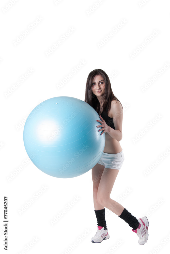Young athletic woman with blue exercise ball Young athletic woman with blue exercise ball
