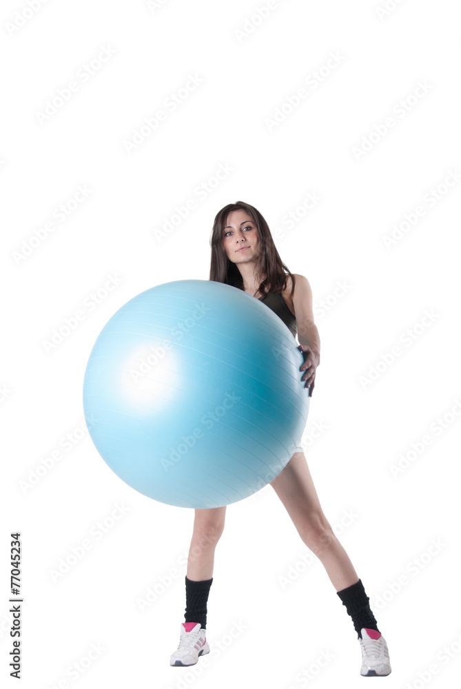 Young athletic woman with blue exercise ball Young athletic woman with blue exercise ball