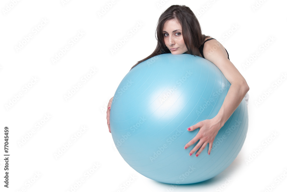 Young athletic woman with blue exercise ball Young athletic woman with blue exercise ball