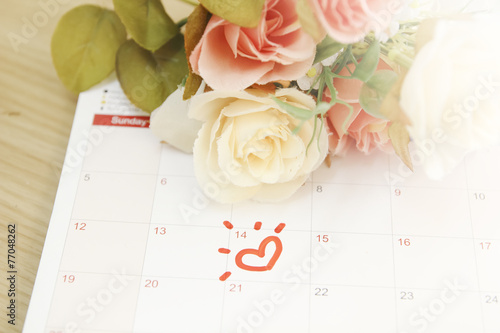 roses and the calendar with the date of February 14 Valentine's