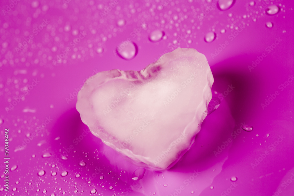 Fototapeta premium Valentines greeting card with ice heart on pink background