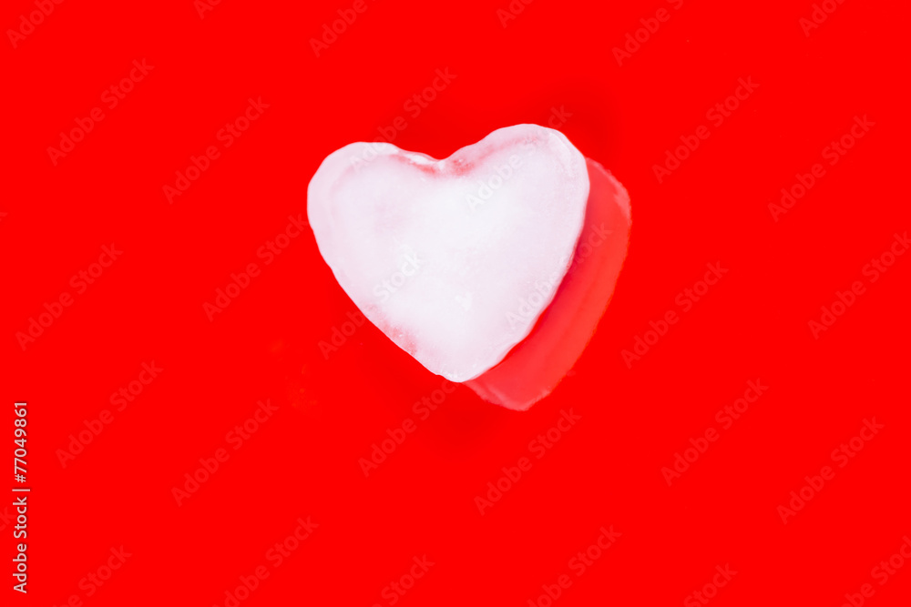 Valentines greeting card with ice heart on red background Valentines greeting card with ice heart on red background