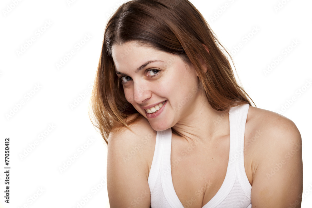 smiling and shy young woman on white background smiling and shy young woman on white background