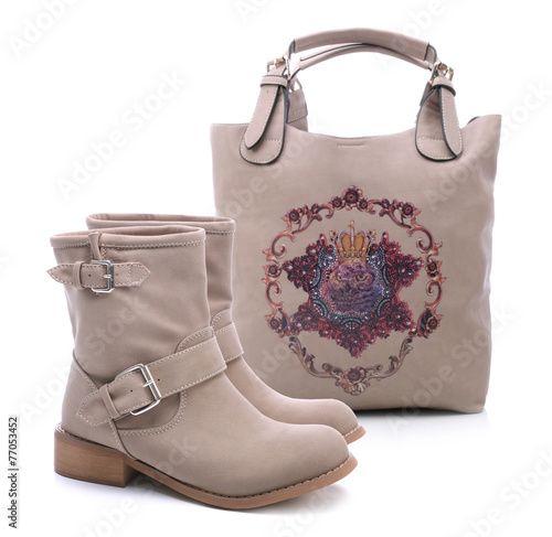 Beige women shoes and handbag on a white background