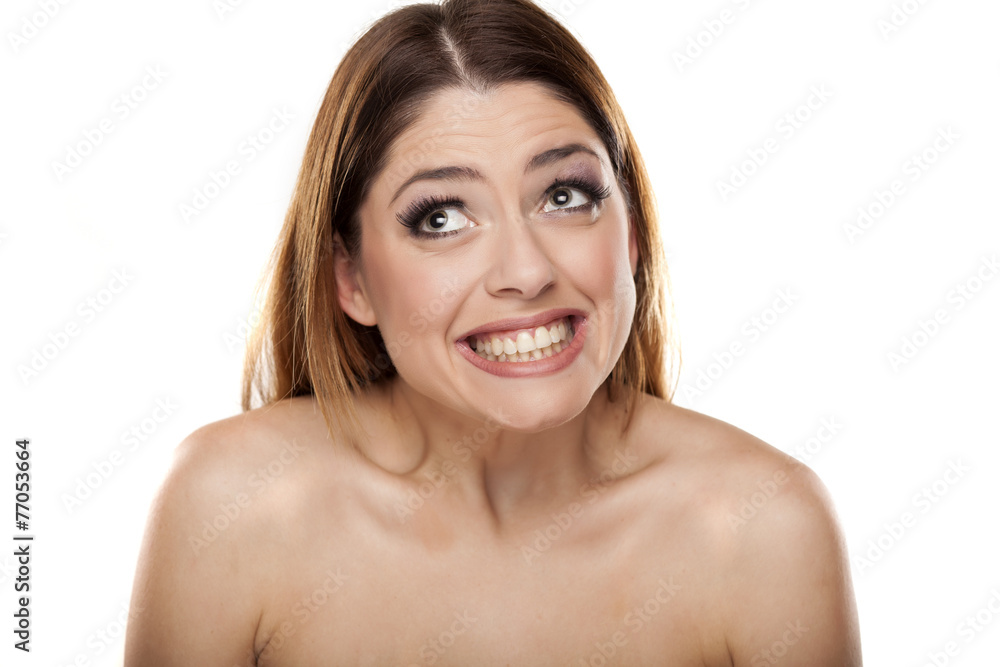 very happy young woman looking up on a white background very happy young woman looking up on a white background