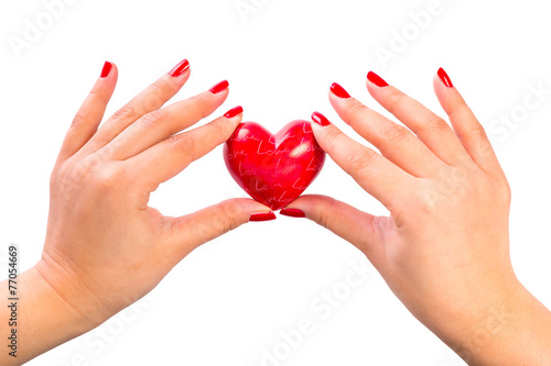 Heart shape in hands as love symbol
