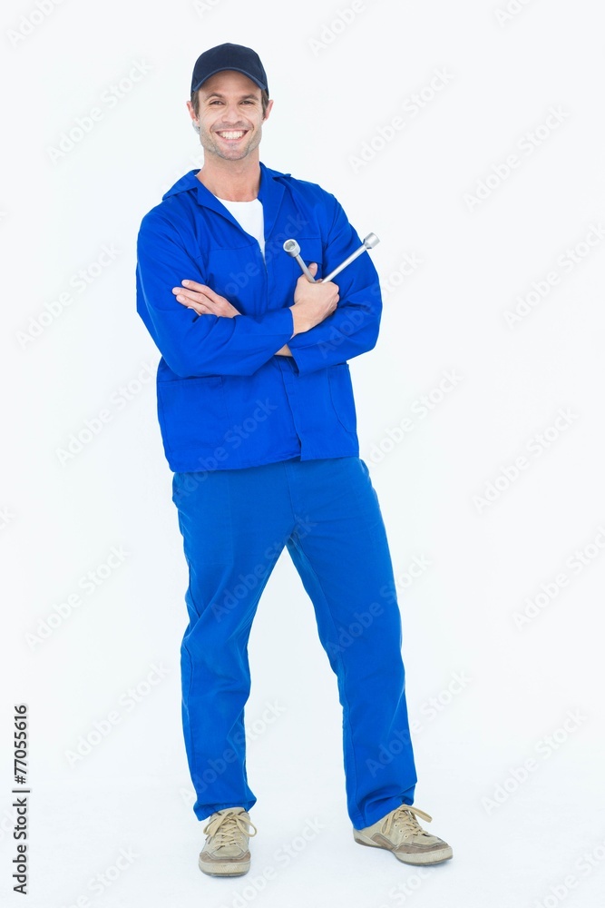 Mechanic holding wheel wrenches Mechanic holding wheel wrenches