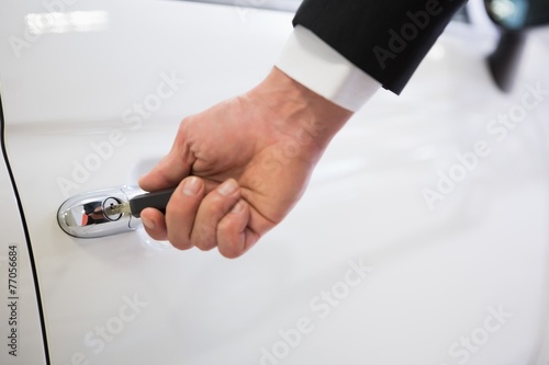 Man opening a car with a key