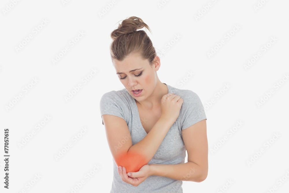 Unhappy woman with elbow pain Unhappy woman with elbow pain