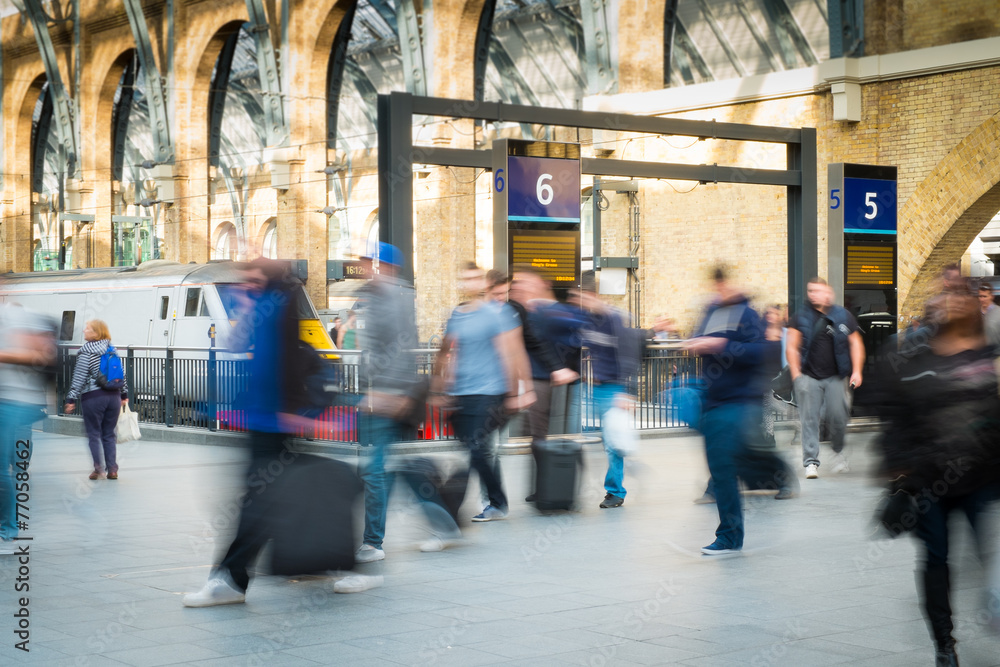 London Train Tube station Blur people movement in rush hour, at