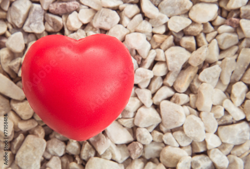 Red heart in love of Valentine's day with stone background.