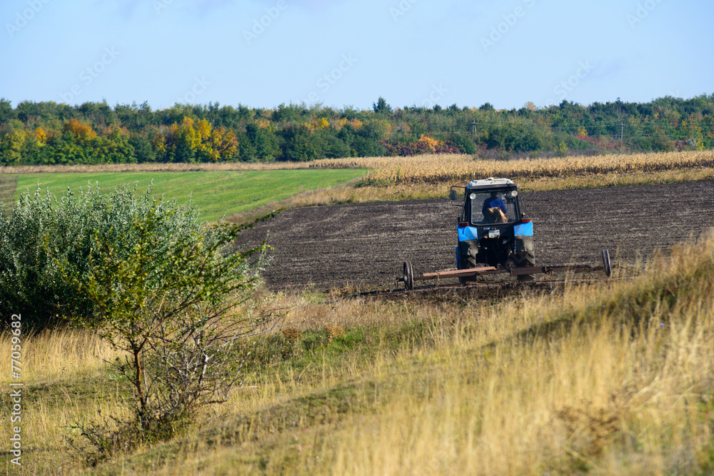 Naklejka premium Tractor plowing