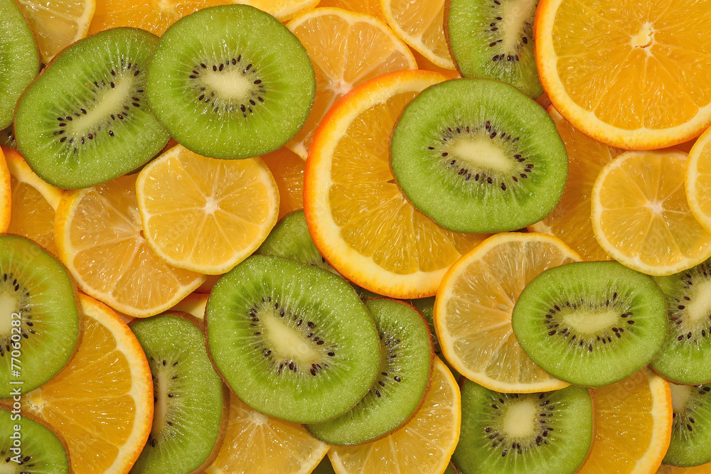 Orange, lemon and kiwi slices background Orange, lemon and kiwi slices background