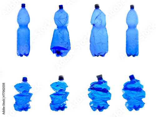 several plastic bottles crushed isolated on white background