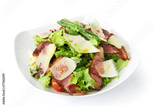 Restaurant food isolated - salad with fried bacon and parmesan