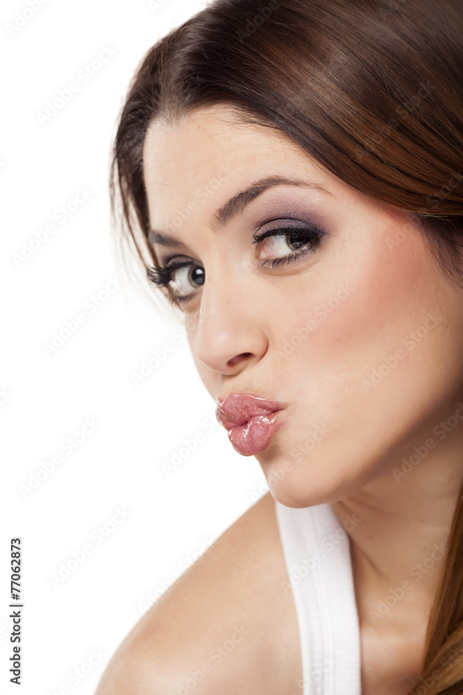 Obraz premium beautiful young woman with kissing gesture