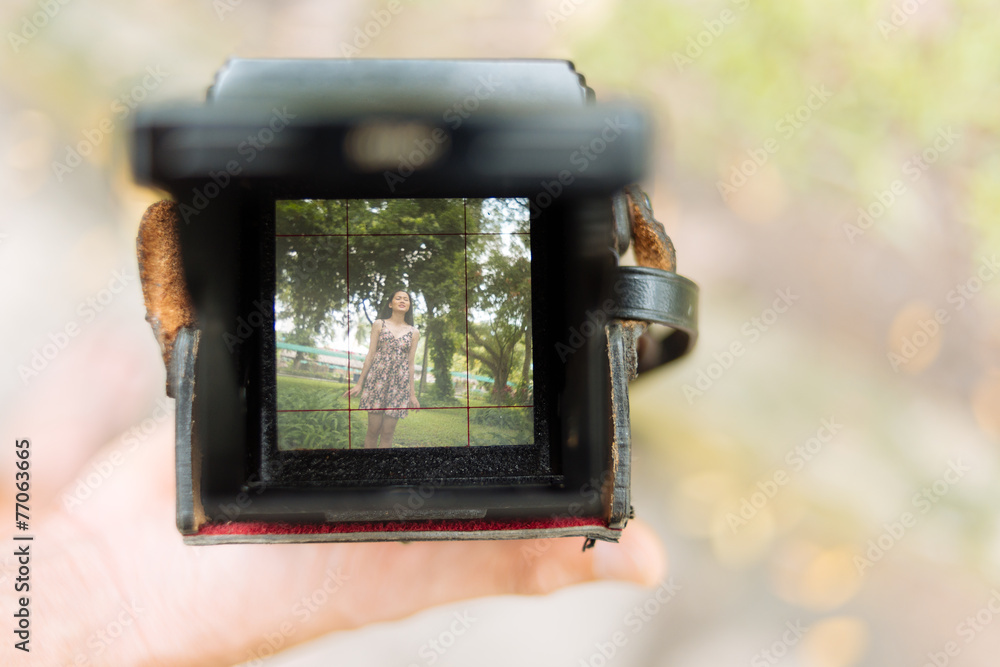 Camera with photo of young girl