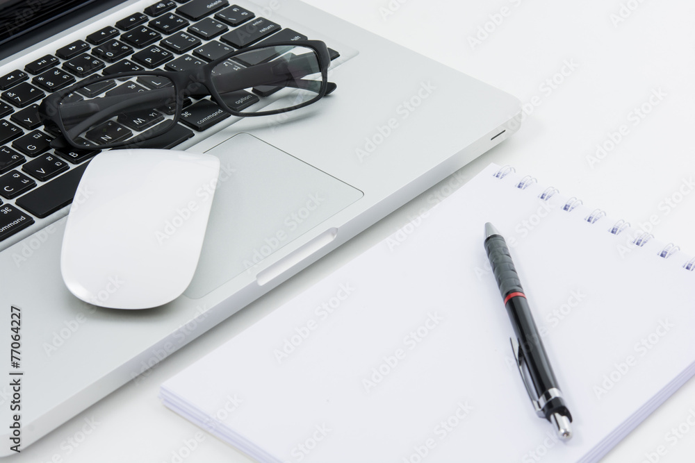 Blank business laptop, mouse, pen, glasses and note Blank business laptop, mouse, pen, glasses and note