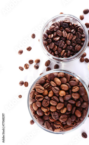Coffee beans in glass jars isolated on white