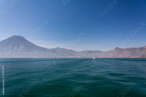 Lake Atitlan boat and volcanoes