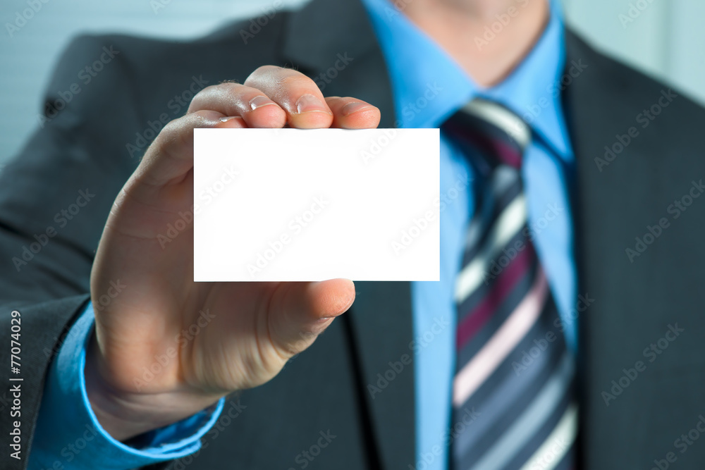 Business man handing a blank business card Business man handing a blank business card