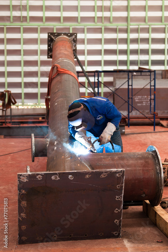 Welder on the pipe