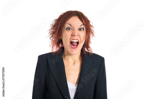Redhead girl shouting over white background