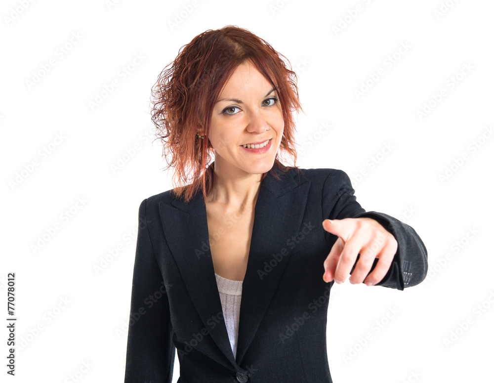 Redhead girl pointing to the front Redhead girl pointing to the front