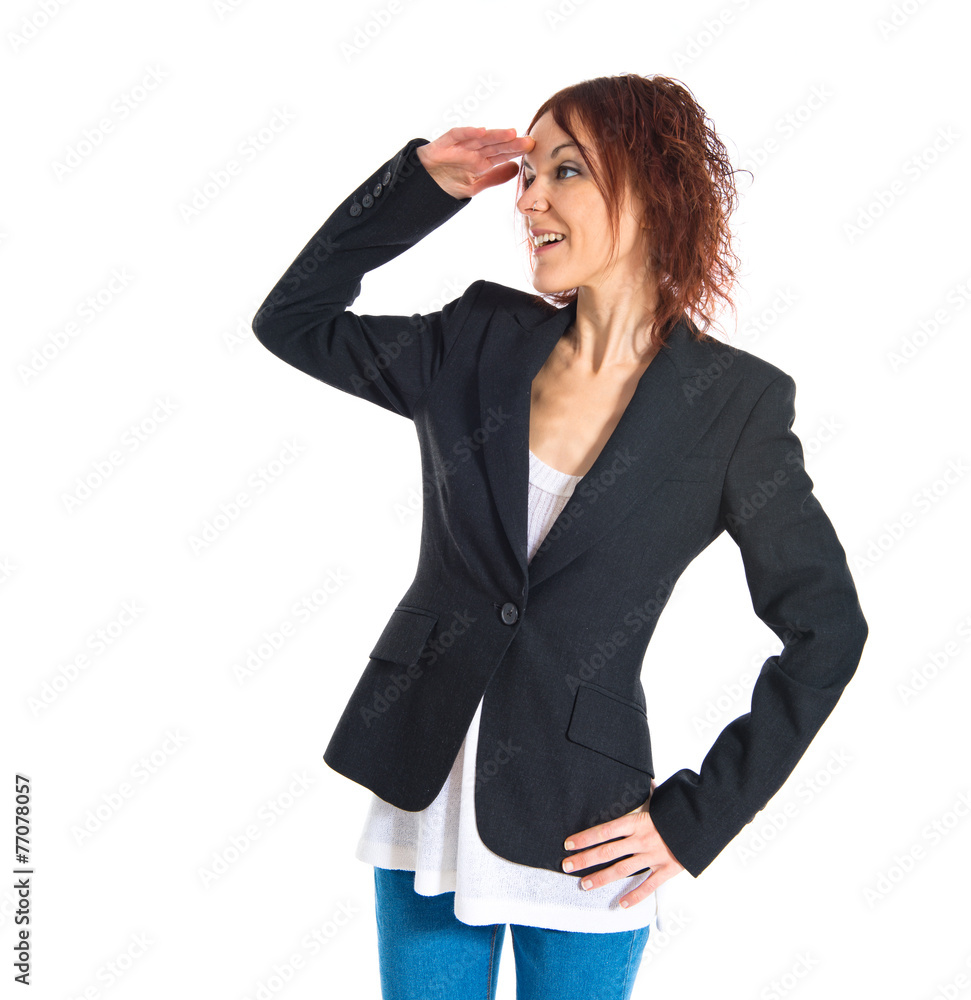 Redhead girl showing something over white background Redhead girl showing something over white background