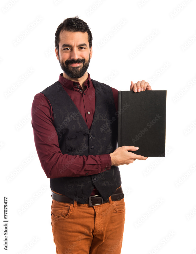 Man wearing waistcoat presenting book Man wearing waistcoat presenting book