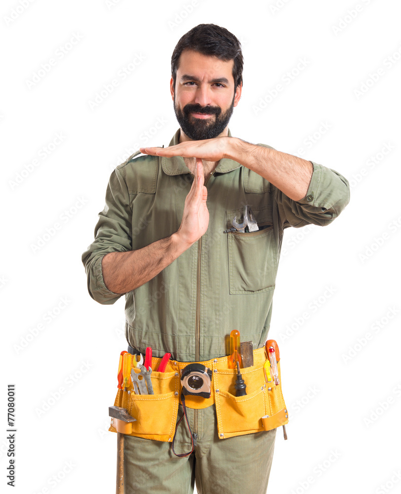 Mechanic making time out gesture Mechanic making time out gesture