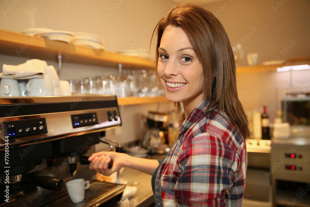 Coffeeshop keeper preparing expresso Coffeeshop keeper preparing expresso