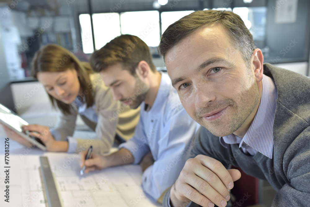 Portrait of architect amongst group in meeting Portrait of architect amongst group in meeting