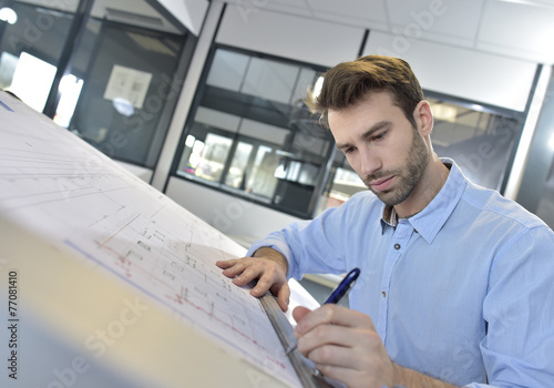 Fotografi Architect designing on drafting table