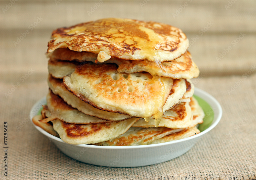 Delicious pancakes with honey, close-up Delicious pancakes with honey, close-up