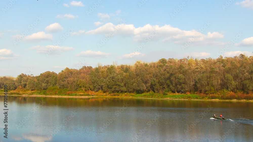 Motorboat floats on the river. Day time floating. Motorboat floats on the river. Day time floating.