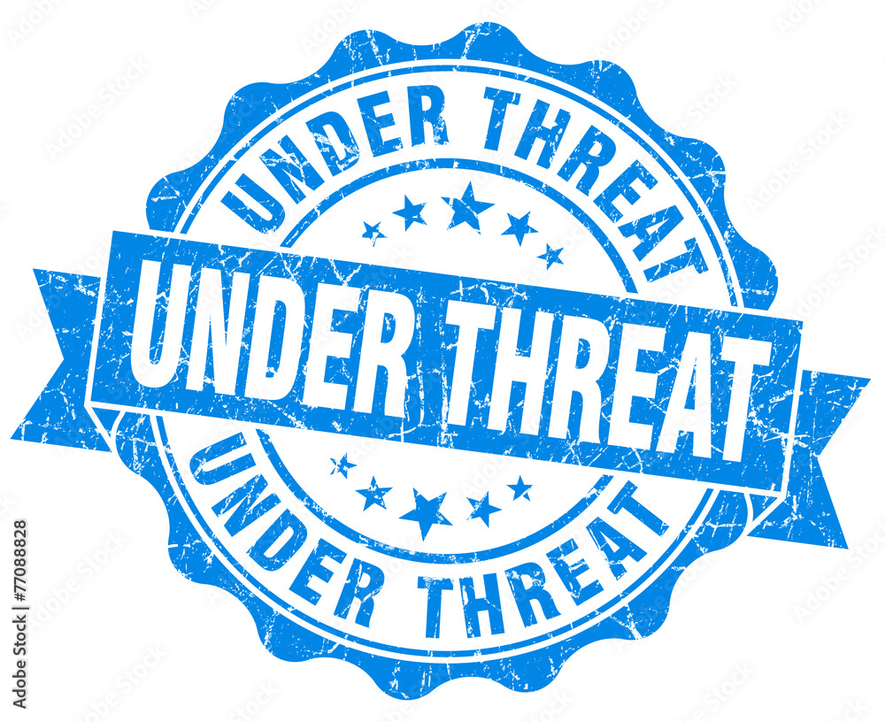 under threat blue grunge seal isolated on white under threat blue grunge seal isolated on white