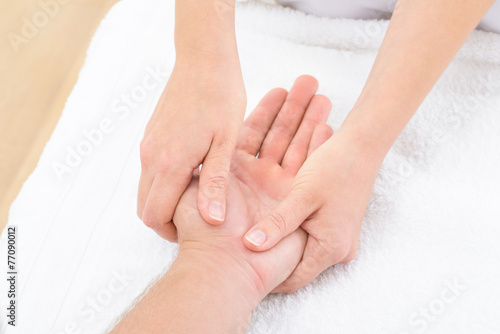 Physiotherapist Massaging Palm