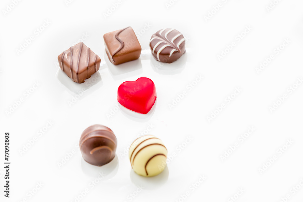 Heart shaped chocolate with other confectionery around Heart shaped chocolate with other confectionery around