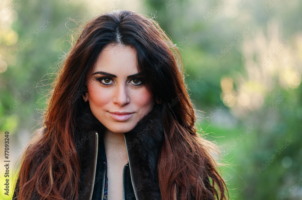 Beautiful young woman walking in the park, selective focus Beautiful young woman walking in the park, selective focus