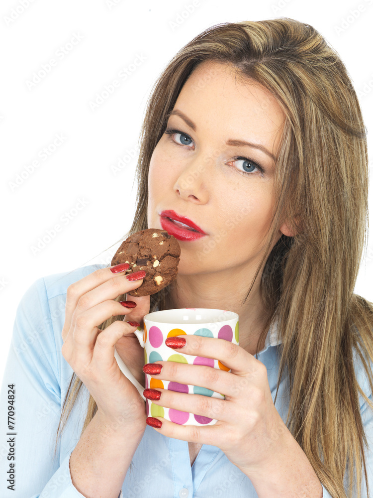 Young Woman Enjoying Tea and Biscuits Young Woman Enjoying Tea and Biscuits