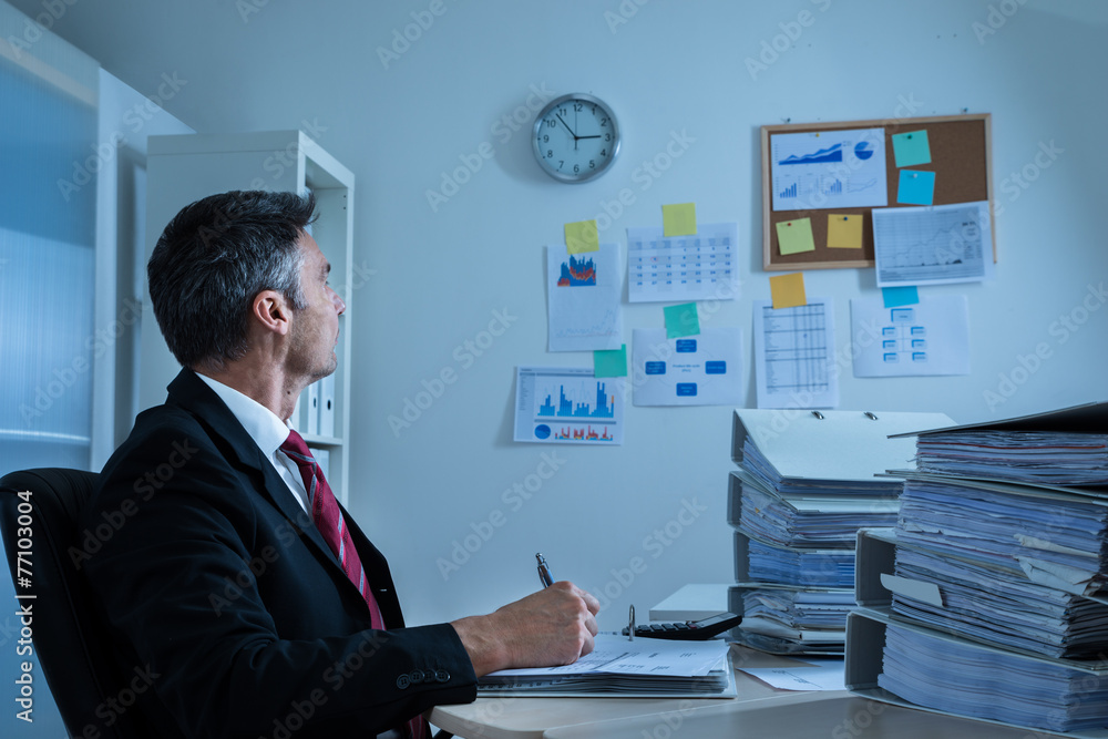 Businessman Looking At Clock