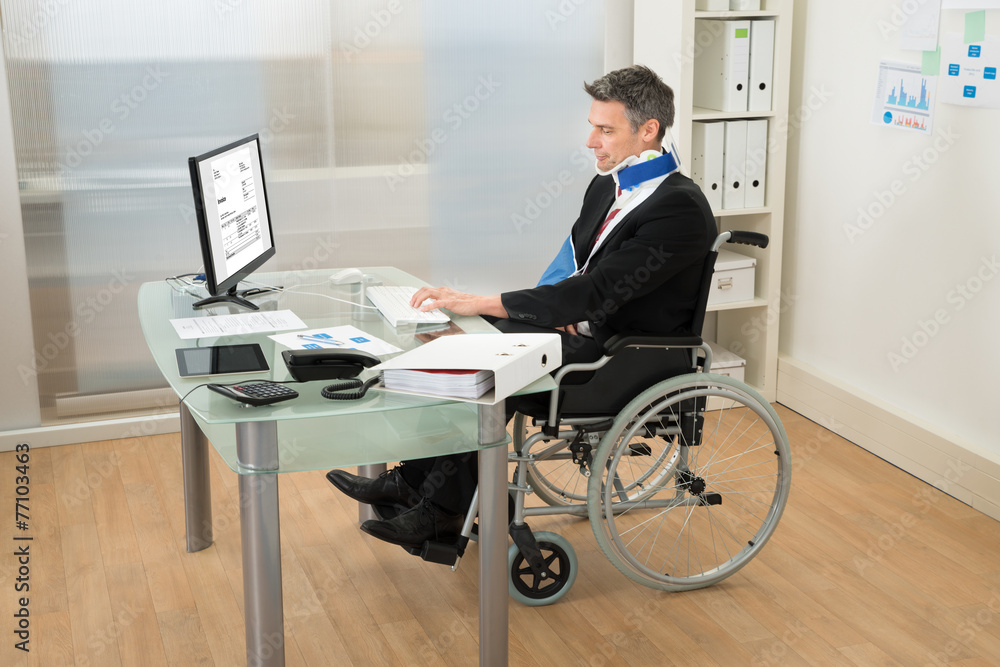 Disabled Businessman Using Computer Disabled Businessman Using Computer