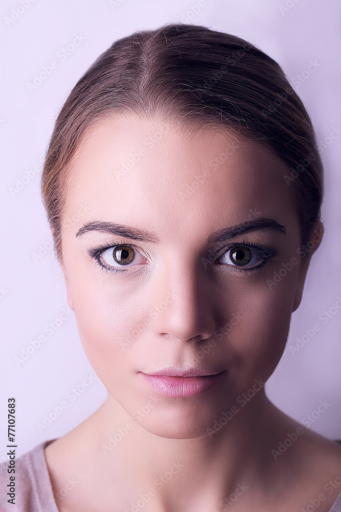 Make-up on young female face, on white background Make-up on young female face, on white background