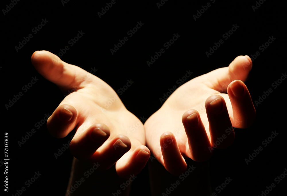 Obraz premium Female hands on dark background