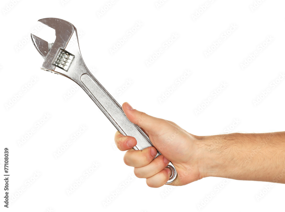 Adjustable wrench in male hand isolated on white Adjustable wrench in male hand isolated on white